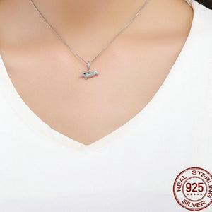 Image of a girl wearing a super-cute studded Dachshund pendant made of 925 Sterling Silver