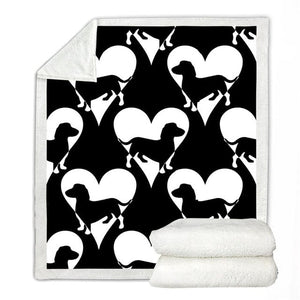 Image of a dachshund blanket with black and white dachshunds and hearts