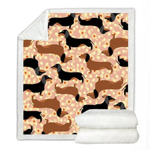 Load image into Gallery viewer, Image of a dachshund blanket with tan and black and tan dachshunds