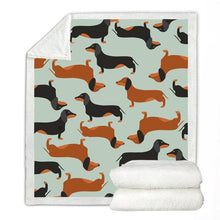 Load image into Gallery viewer, Image of a dachshund print blanket with tan and black and tan dachshunds design