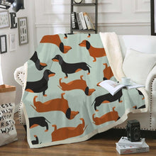 Load image into Gallery viewer, Image of a dachshund blanket with tan and black and tan dachshunds design