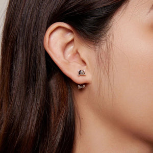 Image of a lady wearing boston terrier earrings in the most adorable Boston Terrier design.