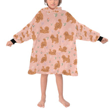 Load image into Gallery viewer, image of a kid wearing a peach colored doodle blanket hoodie for kids