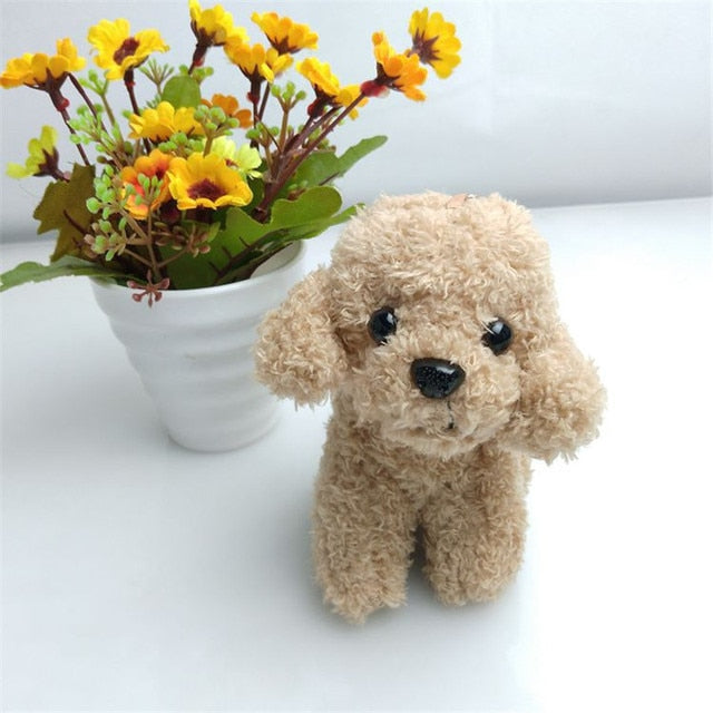 Image of a super cute goldendoodle keychain 