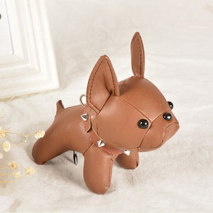 Image of a french bulldog keychain in the color brown made of PU leather