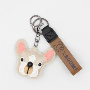 Image of a white color frenchie keychain with strap made of PU leather