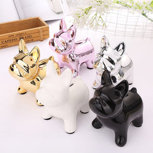 Image of five frenchie piggy banks in the color black, silver, gold, pink, and white