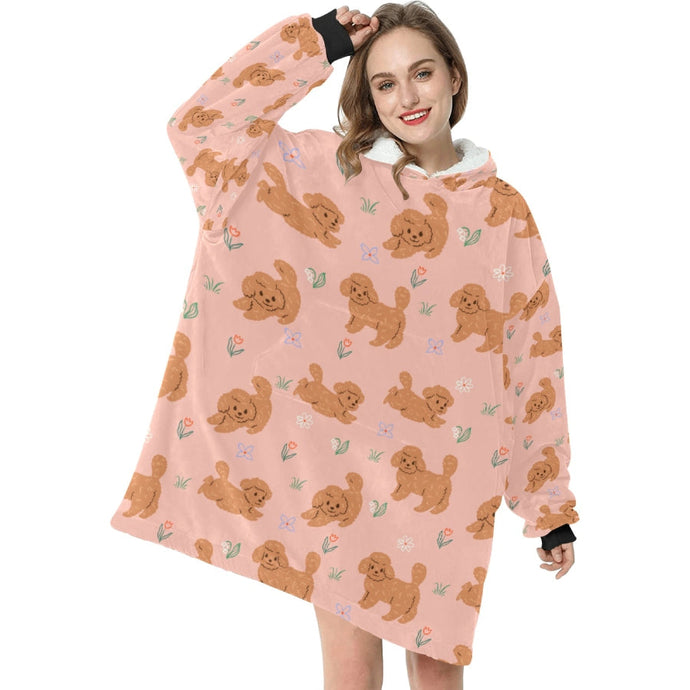 image of a woman wearing a doodle blanket hoodie - peach
