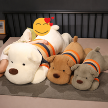 Load image into Gallery viewer, A lady in bed with three Pit Bull stuffed animal plush toys in White, Red and Blue coat colors.