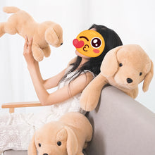 Load image into Gallery viewer, A woman sitting on a gray sofa holds and cuddles three plush golden retriever puppy toys in a bright indoor setting. The woman's face is covered by a winking emoji sticker.
