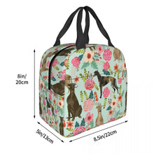 Load image into Gallery viewer, Image of the size of an insulated green color Whippet bag with exterior pocket in bloom design