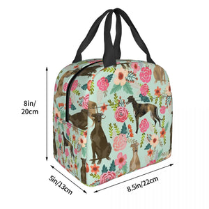 Image of the size of an insulated green color Whippet bag with exterior pocket in bloom design