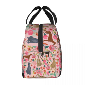 Side image of an insulated pink color Greyhound lunch bag with exterior pocket in bloom design