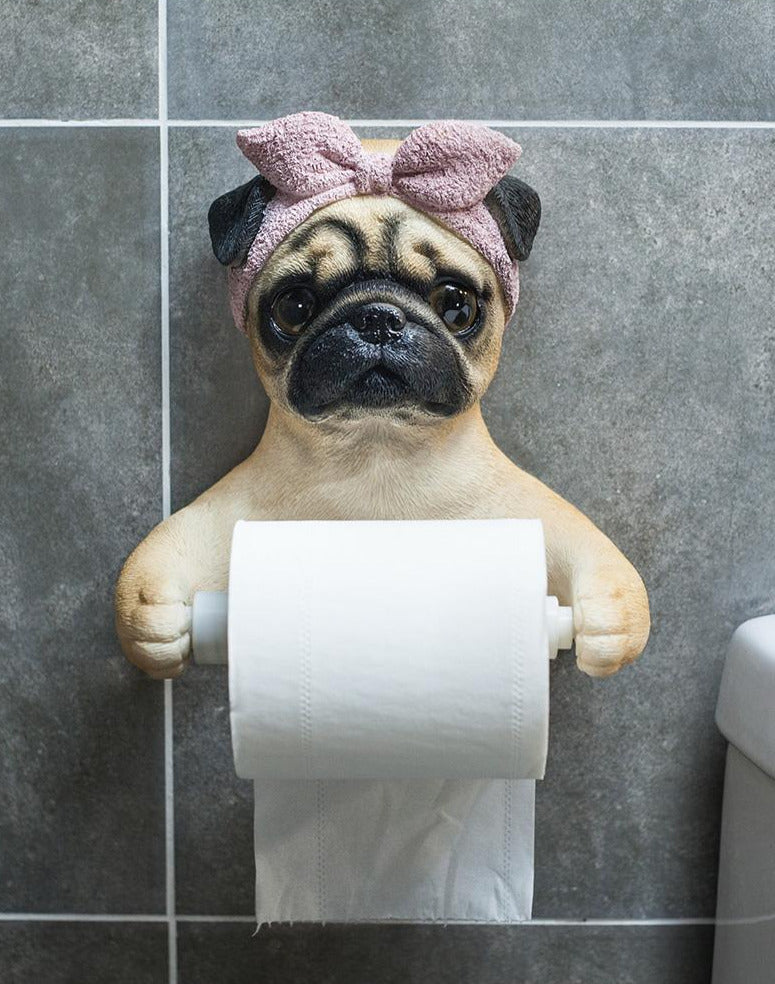 Image of a she pug toilet paper holder wearing bowtie headscarf