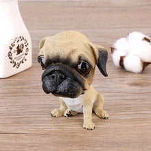 Load image into Gallery viewer, Image of a Pug bobblehead sitting on the floor