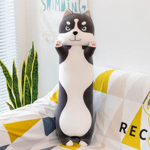 Image of a super cute Husky stuffed animal plush toy pillow standing on the couch