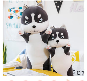 Image of two realistic Husky stuffed animal plush toy pillows in different sizes standing and raising their hands
