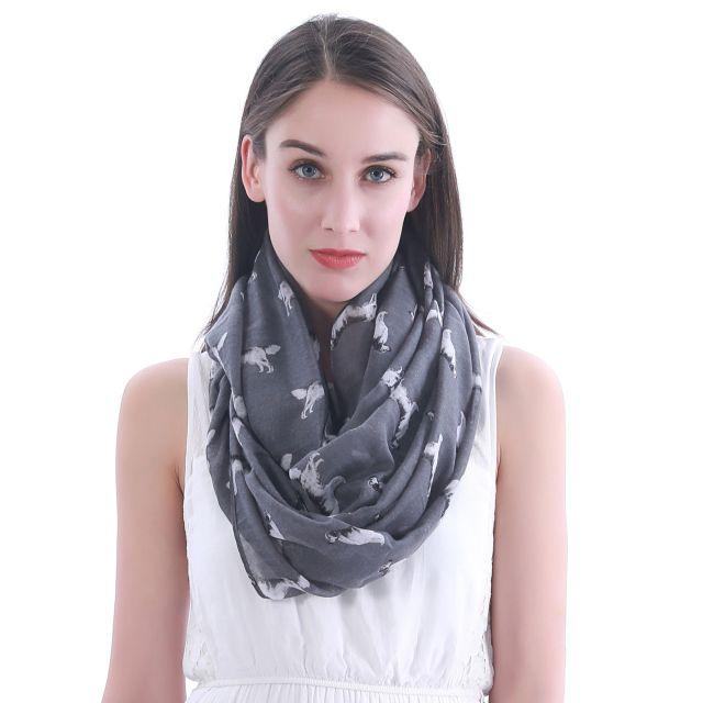Image of a girl wearing a beautful Golden Retriever scarf in the color dark grey with infinite Golden Retrievers design