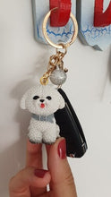 Load image into Gallery viewer, Image of a lady holding a bichon frise keychain