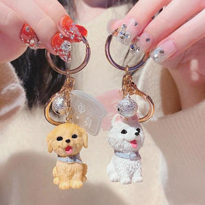 Image of two super-cute Golden Retriever and Samoyed keychains in 3D designs