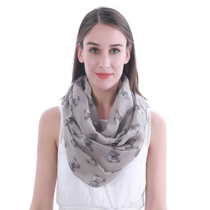 Image of a girl wearing a beautful Shih Tzu scarf in the color Khaki with infinite Shih Tzu design