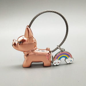 Image of a girl frenchie keychain in the color rose gold