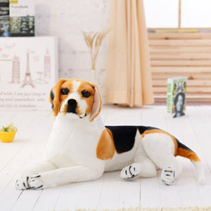 image of a woman playing with an adorable beagle stuffed animal plush toy