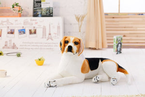 image of a woman playing with an adorable beagle stuffed animal plush toy