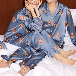 Image of two girls sitting on the bed wearing shiba inu pajama