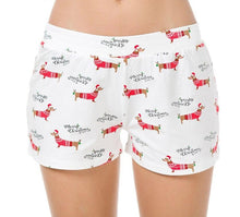 Load image into Gallery viewer, Image of a lady wearing dachshund pajama bottoms