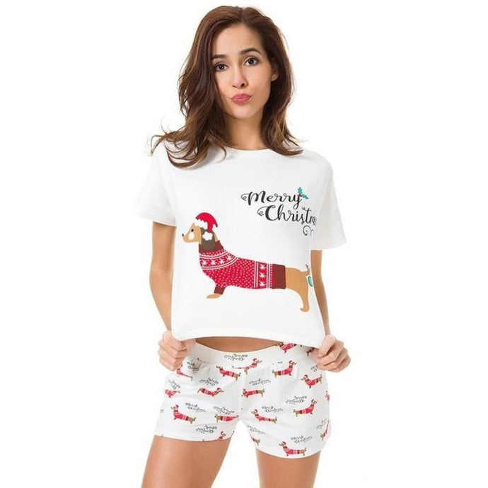 Image of a lady wearing dachshund christmas pajamas with a merry Christmas dachshund design