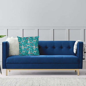 Image of a Dalmatian Cushion Cover kept on the blue color couch in Merry Christmas Dalmatian and Christmas ornaments design