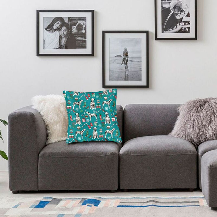 Image of a Dalmatian Cushion Cover kept on the grey color couch in Merry Christmas Dalmatian and Christmas ornaments design