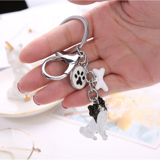Image of a super cute Papillon keychain in the shape of the beautiful standing Papillon design