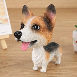 Image of a smiling Cardigan Welsh Corgi bobblehead standing on the floor