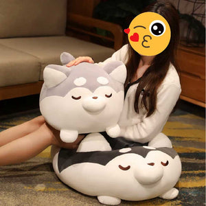 Image of a girl sitting on the floor with her Husky Stuffed Animal Plush Toy Pillows