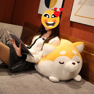 Image of a girl sitting on the bed and using a Husky Stuffed Animal Plush Toy Pillow as a back rest