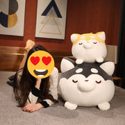 Image of a girl sitting on the bed with her two Husky Stuffed Animal Plush Toy Pillow in Small and Large Size