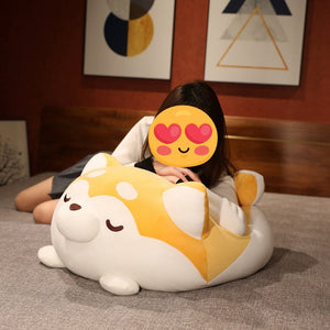 This image shows a plumpy Shiba Inu stuffed animal plush toy pillow that can be used to lay around comfortably on the bed.