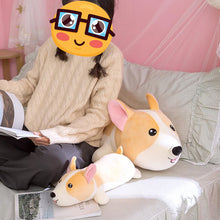 Load image into Gallery viewer, Image of a girl using a Corgi Plush toy pillows as a back rest