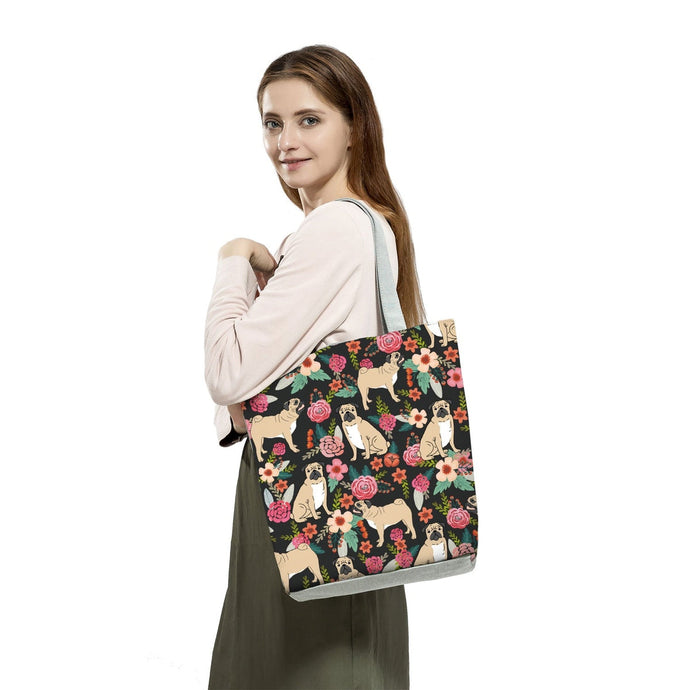 Image of a lady carrying Pug tote bag in a most adorable Pug in bloom design