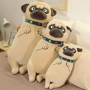 Image of three Pug stuffed animal plush toy pillows standing next to each other on the bed in different sizes