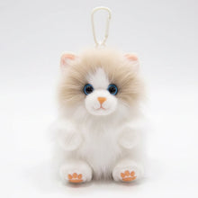 Load image into Gallery viewer, Three fluffy cat-shaped plush keychains with blue eyes and orange paw pads, attached to a cream nylon bag. The keychains come in brown, cream-and-white, and black-and-white colorways.