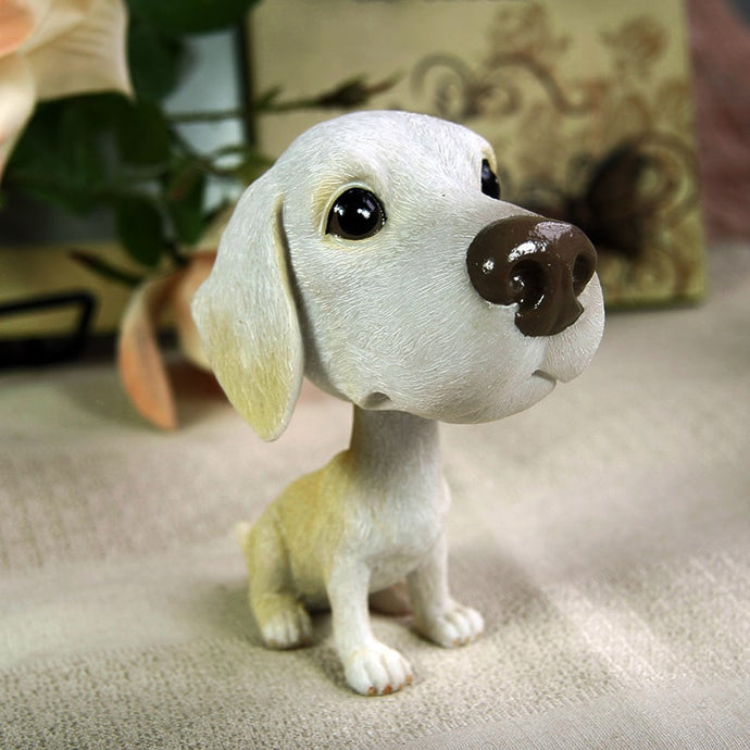 Image of an adorable realistic and lifelike Yellow Lab bobblehead