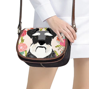 Image of a lady carrying a Schnauzer bag with Schnauzer in bloom design