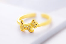Load image into Gallery viewer, Image of a gold Scottie dog ring in sparkling white-stone studded Scottish Terrier design