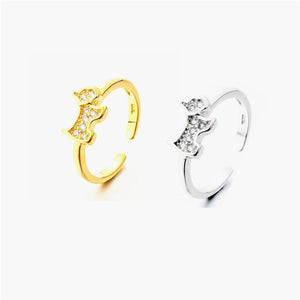 Image of a silver and gold color Scottie dog rings in sparkling white-stone studded Scottish Terrier design