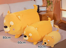 Load image into Gallery viewer, Image of three sleeping Shiba Inu stuffed animal plush toy pillows in different sizes lying on the bed