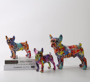 Image of three multicolor frenchie statues made of resin