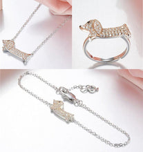 Load image into Gallery viewer, Image of a beautiful silver stone studded Dachshund jewelry set including ring, bracelet and necklace